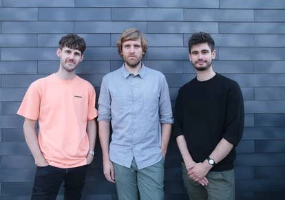 团队成员合影，展示Harry Nesbitt、Joe Grainger、Todd Baker